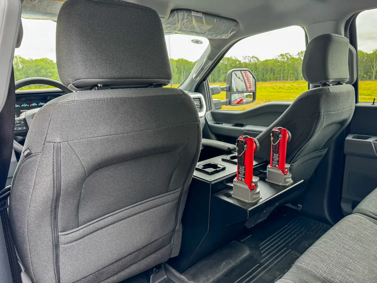 Rear cabin view toward front seats showing console and seatback spacing.